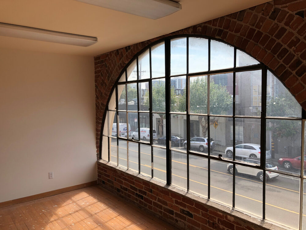 732 Brannan Street arched window and brick wall