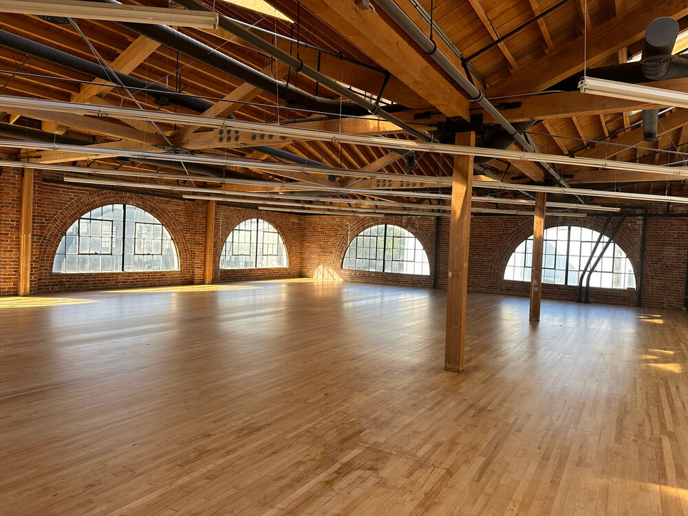 732 Brannan Street open floor with exposed timber trusses